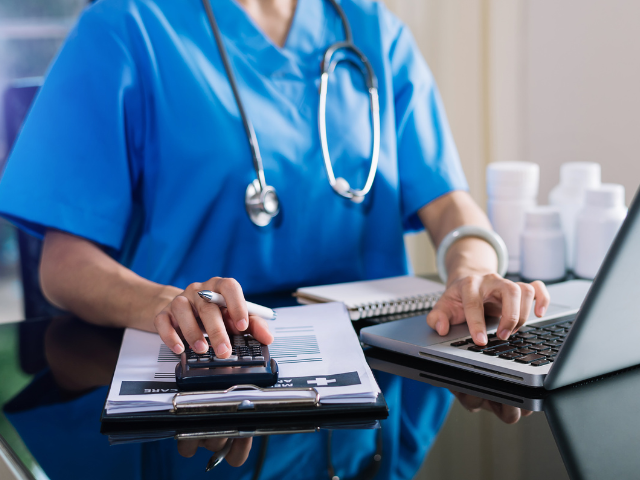 Healthcare billing work at a laptop